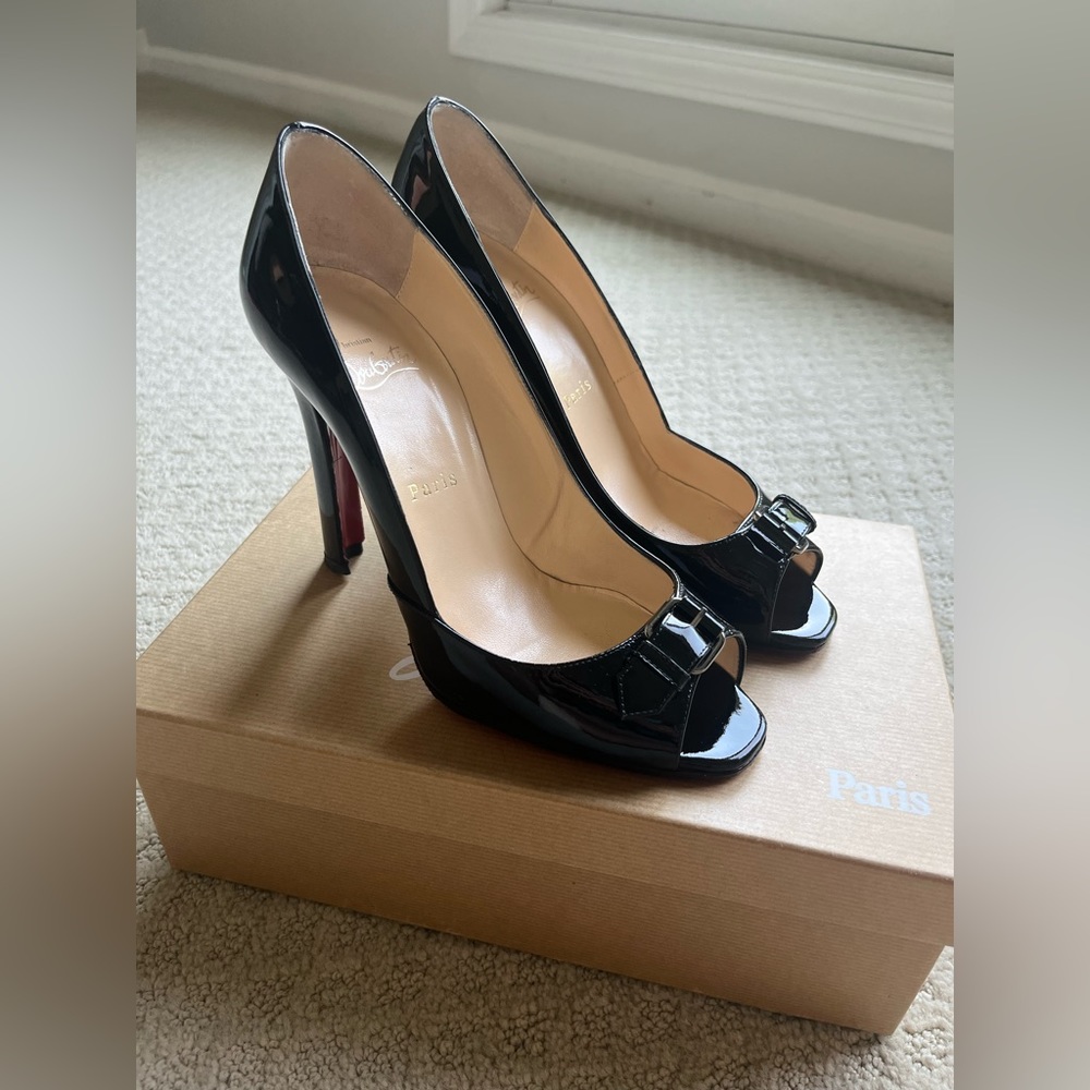 Christian Louboutin Black Leather Patent Buckle open toed Pumps.